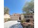 Charming single-Gathering home with a well-maintained lawn and a spacious driveway with an attached two-car garage at 1540 Sabatini Dr, Henderson, NV 89052
