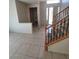 Inviting foyer with tile flooring, staircase, and natural light, creating a welcoming entry into the home at 1540 Sabatini Dr, Henderson, NV 89052
