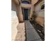 Charming entryway with a gray front door and a landscaped walkway with plants at 1540 Sabatini Dr, Henderson, NV 89052
