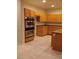 Bright kitchen with stainless steel oven, granite countertops, an island, and ample cabinet space at 1540 Sabatini Dr, Henderson, NV 89052