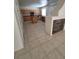 Bright, open kitchen area featuring an island, tile flooring, and granite countertops at 1540 Sabatini Dr, Henderson, NV 89052