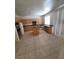 Bright, open kitchen with an island, tile flooring, and granite countertops, perfect for cooking and entertaining at 1540 Sabatini Dr, Henderson, NV 89052