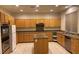Spacious kitchen with stainless steel appliances, granite countertops, an island, and ample cabinet space at 1540 Sabatini Dr, Henderson, NV 89052