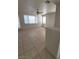 Open living area with tile flooring, a ceiling fan, and bright natural light at 1540 Sabatini Dr, Henderson, NV 89052
