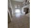 Spacious living room with high ceilings, large windows, and neutral tile flooring, offering ample natural light at 1540 Sabatini Dr, Henderson, NV 89052