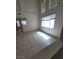Open living area with tile floors and large bright windows for natural light at 1540 Sabatini Dr, Henderson, NV 89052