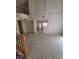 Spacious living room with tile floors, fireplace, and access to many other rooms at 1540 Sabatini Dr, Henderson, NV 89052