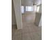 Open living area with tile flooring, a ceiling fan, and bright natural light at 1540 Sabatini Dr, Henderson, NV 89052