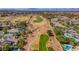 Estate aerial view showing pristine golf course and the backyard pool and green spaces of the community at 165 Inveraray Ct, Henderson, NV 89074