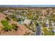 An overhead shot of the property, showcasing the neighborhood, golf course and pool at 165 Inveraray Ct, Henderson, NV 89074