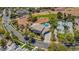 Aerial view of a luxurious home with a tile roof, swimming pool, and well-manicured yard at 165 Inveraray Ct, Henderson, NV 89074