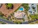 A sprawling luxury estate with a private pool, green landscaping, and proximity to a golf course at 165 Inveraray Ct, Henderson, NV 89074