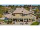Spacious backyard with a covered patio, lounge area, and a well-manicured lawn at 165 Inveraray Ct, Henderson, NV 89074
