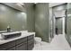 Bathroom featuring an undermount sink, and stone walk-in shower at 165 Inveraray Ct, Henderson, NV 89074