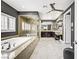 Elegant bathroom with a soaking tub, granite countertops, and a glass-enclosed shower at 165 Inveraray Ct, Henderson, NV 89074
