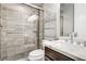 Modern bathroom features marble walk-in shower, vanity, and stylish fixtures at 165 Inveraray Ct, Henderson, NV 89074