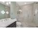 Bathroom with white marble shower featuring a glass door and bench at 165 Inveraray Ct, Henderson, NV 89074