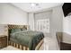 Serene bedroom featuring large windows, tile floors, and designer bedding at 165 Inveraray Ct, Henderson, NV 89074