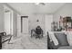 Bright bedroom featuring marble-look floors and multiple doors at 165 Inveraray Ct, Henderson, NV 89074