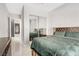 Well-lit bedroom showcases a mirror sliding closet door at 165 Inveraray Ct, Henderson, NV 89074
