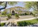 Charming two-story home featuring a landscaped front yard, stone accents, and a welcoming entrance at 165 Inveraray Ct, Henderson, NV 89074