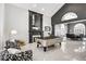 Elegant game room with fireplace, pool table, and stylish seating creates a luxurious entertainment space at 165 Inveraray Ct, Henderson, NV 89074