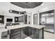 Open concept kitchen features granite countertops, stainless steel appliances and eat-in island at 165 Inveraray Ct, Henderson, NV 89074