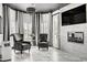 Stylish living room featuring marble floors, a modern fireplace, and elegant striped curtains at 165 Inveraray Ct, Henderson, NV 89074