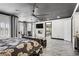 Elegant bedroom featuring a bed, seating area, and ensuite bathroom with a fireplace at 165 Inveraray Ct, Henderson, NV 89074