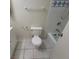 Standard bathroom with a white toilet, tub and tiled walls at 1673 Caliente Ct, Las Vegas, NV 89119