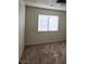 Cozy bedroom with plush carpet and a window providing natural light at 1673 Caliente Ct, Las Vegas, NV 89119