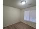 Bedroom offers neutral walls, carpet flooring, and a window for natural lighting at 1673 Caliente Ct, Las Vegas, NV 89119