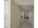 Hallway with tiled flooring, white walls and a storage closet at 1673 Caliente Ct, Las Vegas, NV 89119