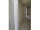 Hallway features neutral walls and ceramic tile flooring for a clean, modern look at 1673 Caliente Ct, Las Vegas, NV 89119