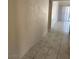 Hallway with tiled flooring and views of rooms down the hall at 1673 Caliente Ct, Las Vegas, NV 89119