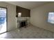 Living room featuring a marble fireplace, tile floors, and natural light from a window at 1673 Caliente Ct, Las Vegas, NV 89119