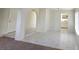 Open living area with tile flooring, archways, and access to the kitchen at 1673 Caliente Ct, Las Vegas, NV 89119