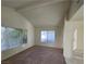 Cozy living room with vaulted ceilings and large windows for natural light at 1673 Caliente Ct, Las Vegas, NV 89119