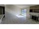 Bright living room with tile flooring, fireplace, and sliding door to the backyard at 1673 Caliente Ct, Las Vegas, NV 89119