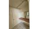 Bathroom vanity area with bright lighting, a countertop, and a door at 1673 Caliente Ct, Las Vegas, NV 89119