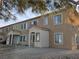 A low angle shot of an apartment complex exterior featuring covered entranceways and gravel landscaping at 2011 Sue Ct # 203, Las Vegas, NV 89108