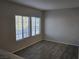Bright, naturally lit living room with modern plank flooring and neutral paint at 2011 Sue Ct # 203, Las Vegas, NV 89108