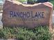 Rancho Lake Condominiums entrance sign made of stone surrounded by green foliage at 2011 Sue Ct # 203, Las Vegas, NV 89108