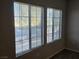 View through large windows with blinds overlooking the neighborhood street at 2011 Sue Ct # 203, Las Vegas, NV 89108