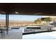 Backyard patio with lounge seating and stunning city views at 21 Rockstream Dr, Henderson, NV 89012