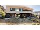 Stunning exterior view of a modern home with desert landscaping and an inviting outdoor area at 21 Rockstream Dr, Henderson, NV 89012