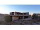 Modern home featuring desert landscaping, stone accents, and sleek architectural design for sophisticated living at 21 Rockstream Dr, Henderson, NV 89012