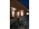 Inviting home entrance featuring modern design, desert landscaping, and unique architectural lighting at 21 Rockstream Dr, Henderson, NV 89012