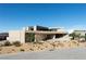 Contemporary home with desert landscaping, showcasing its architectural design at 21 Rockstream Dr, Henderson, NV 89012