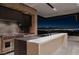 Modern kitchen with stainless steel appliances and an island, with a panoramic city view at 21 Rockstream Dr, Henderson, NV 89012